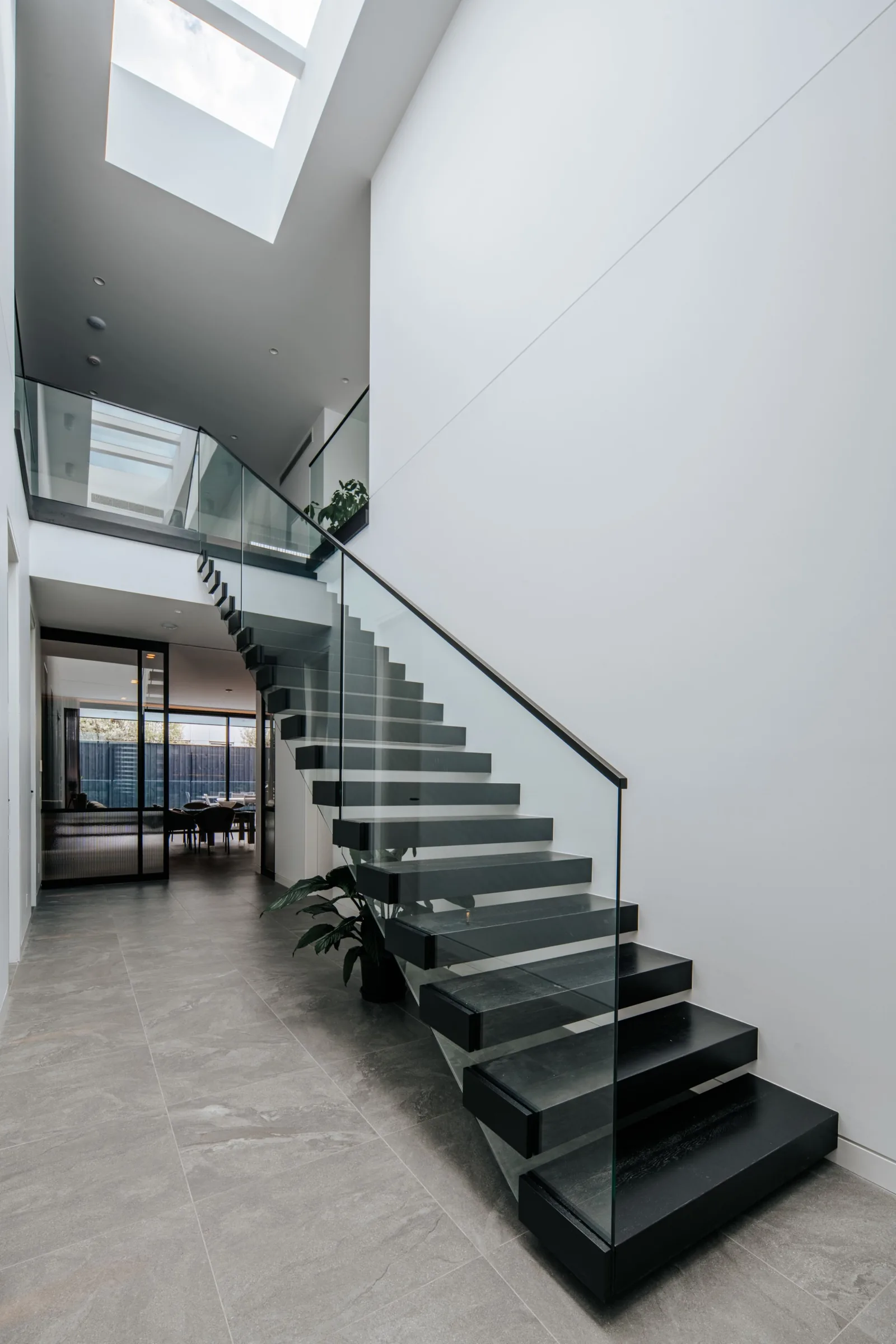 White stair void with skylight above
