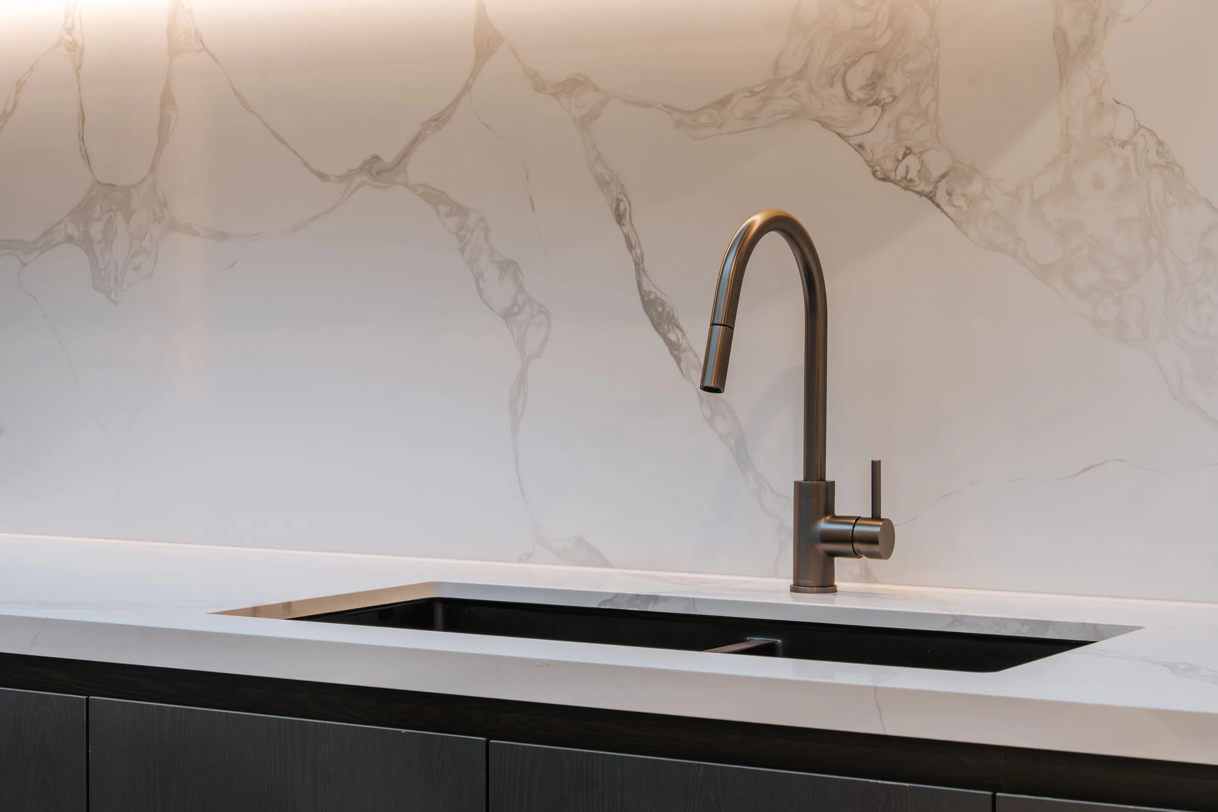 Calacatta marble splashback and brushed nickel tapware