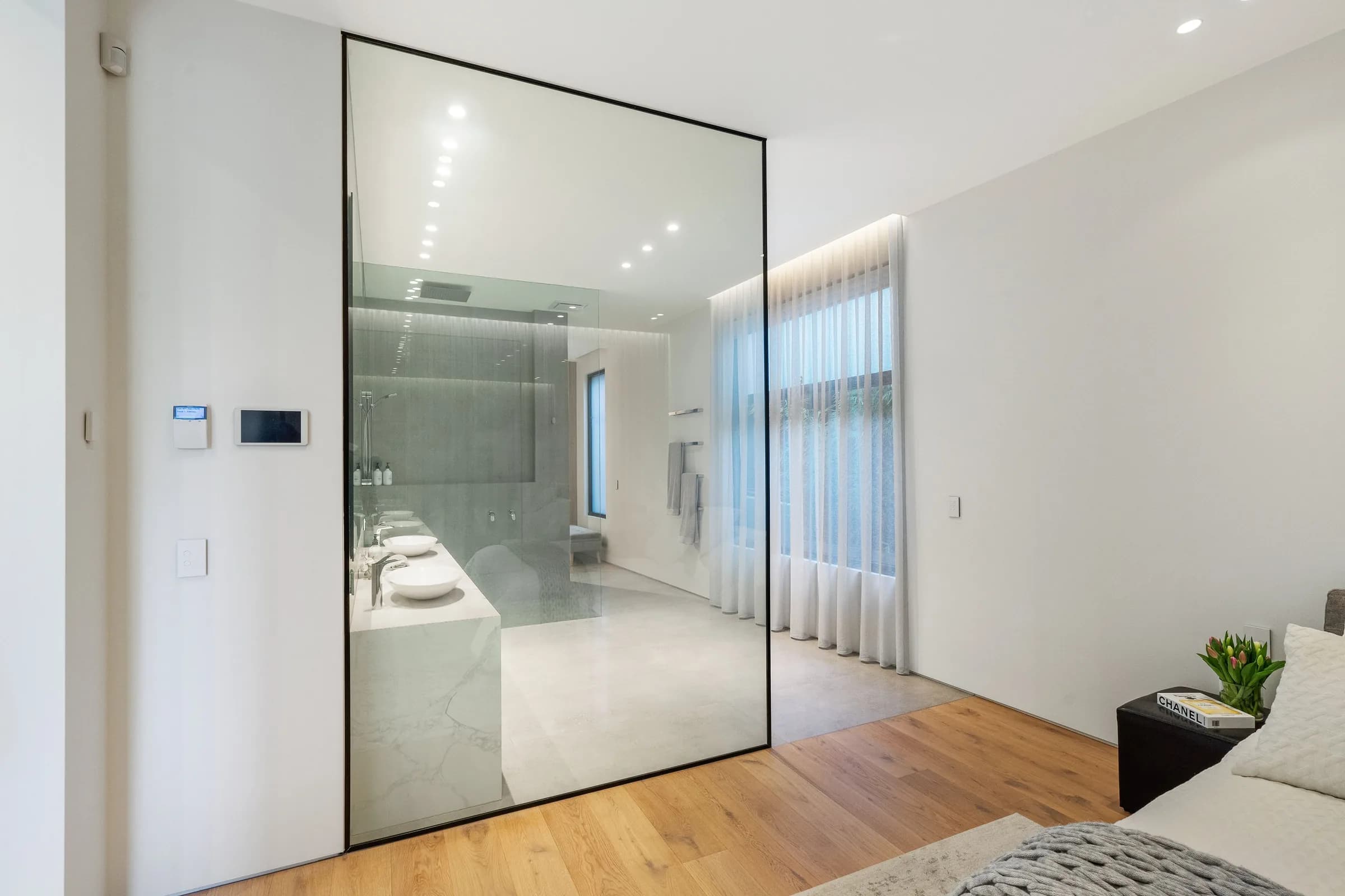 Translucent sliding panel glowing beside the bedroom